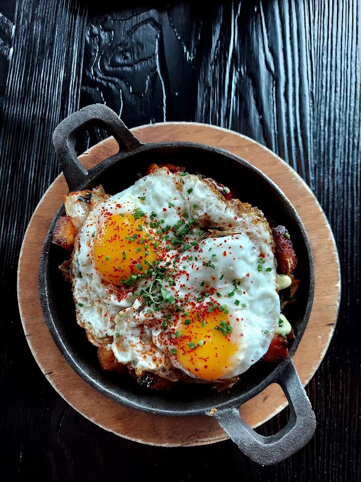 skillet of pork and eggs