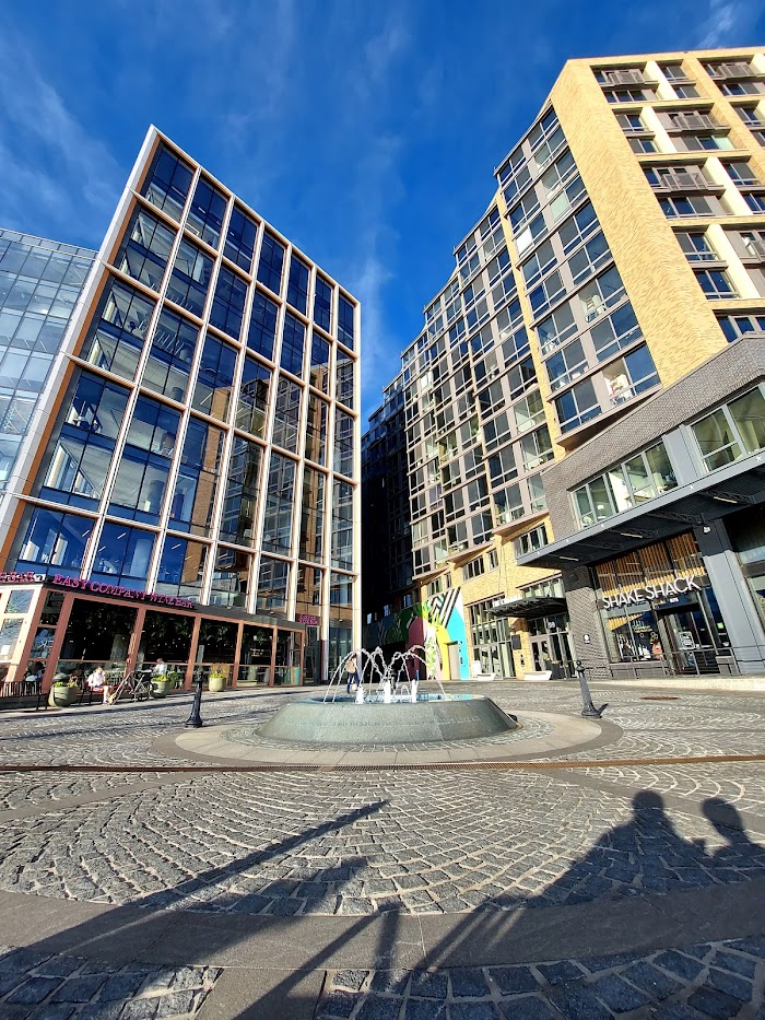 water fountain with glass building