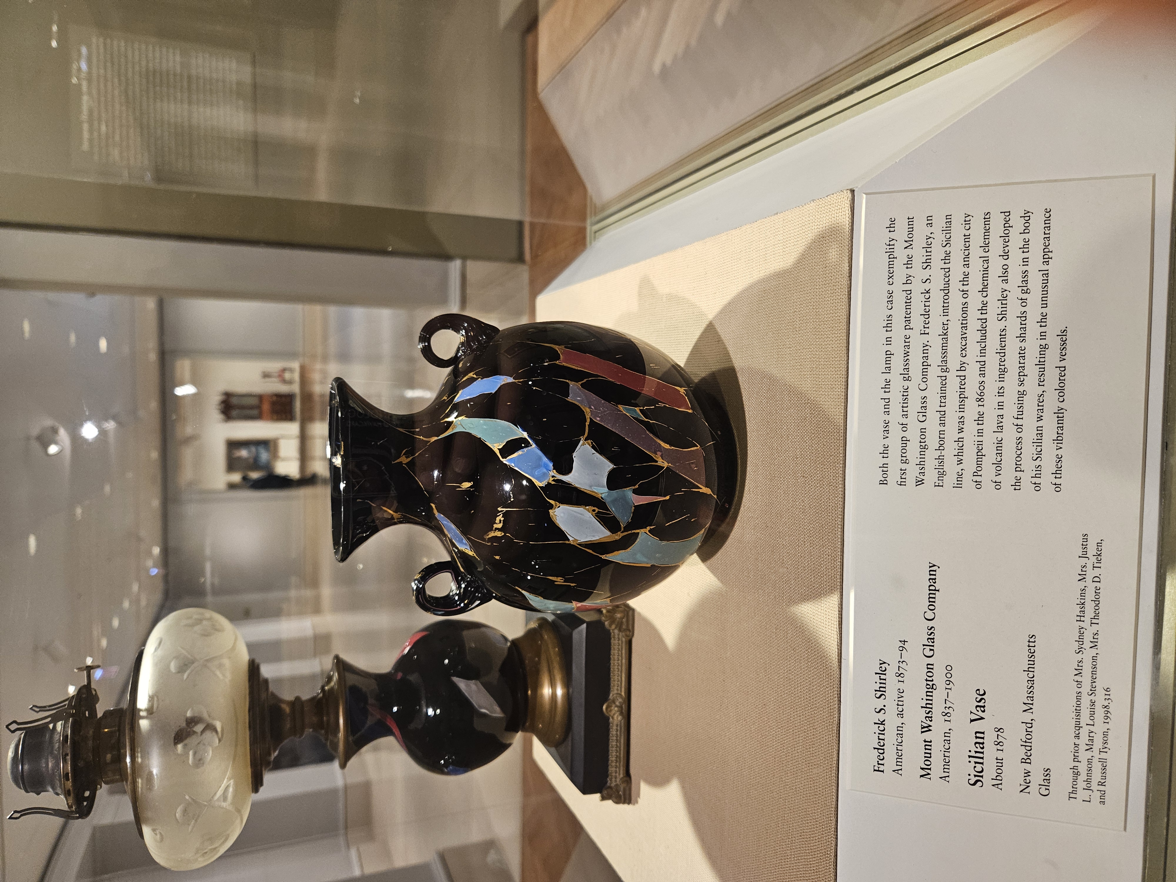 vase with gold cracks patching together colored glass
