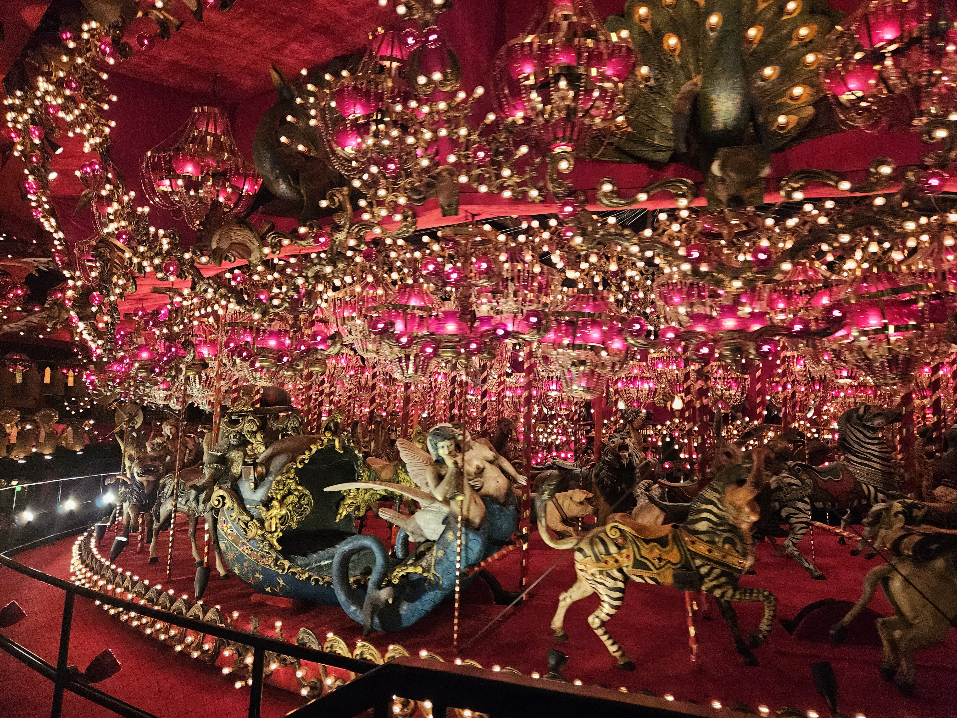 red and gold carosel in the dark with horses