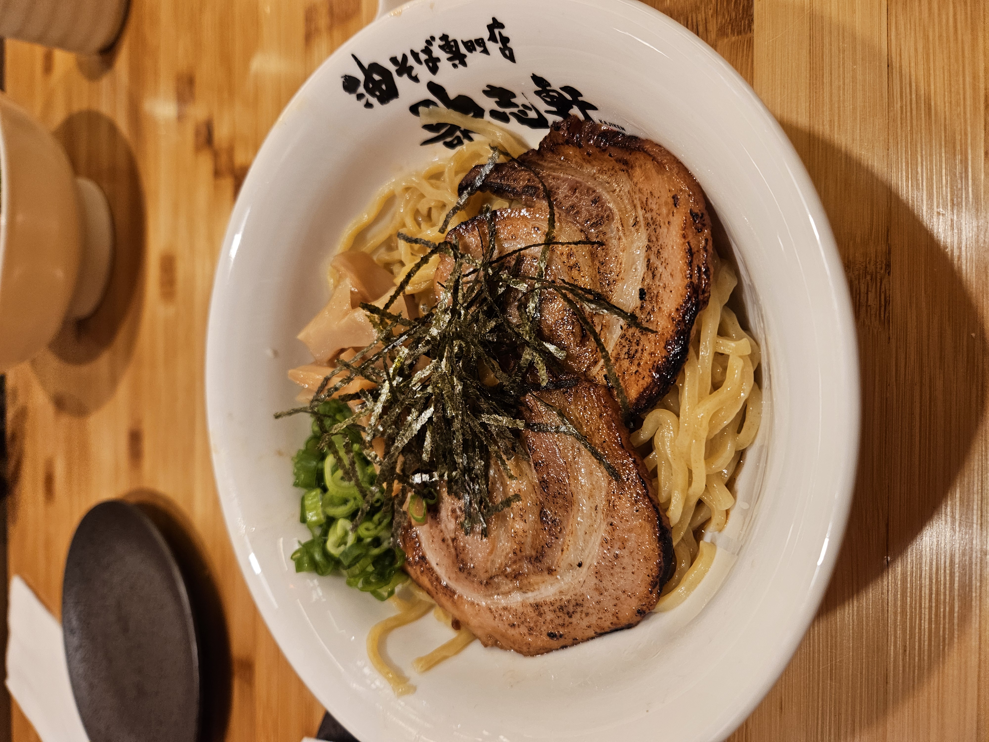 pork on noodles topped with shredded seaweed