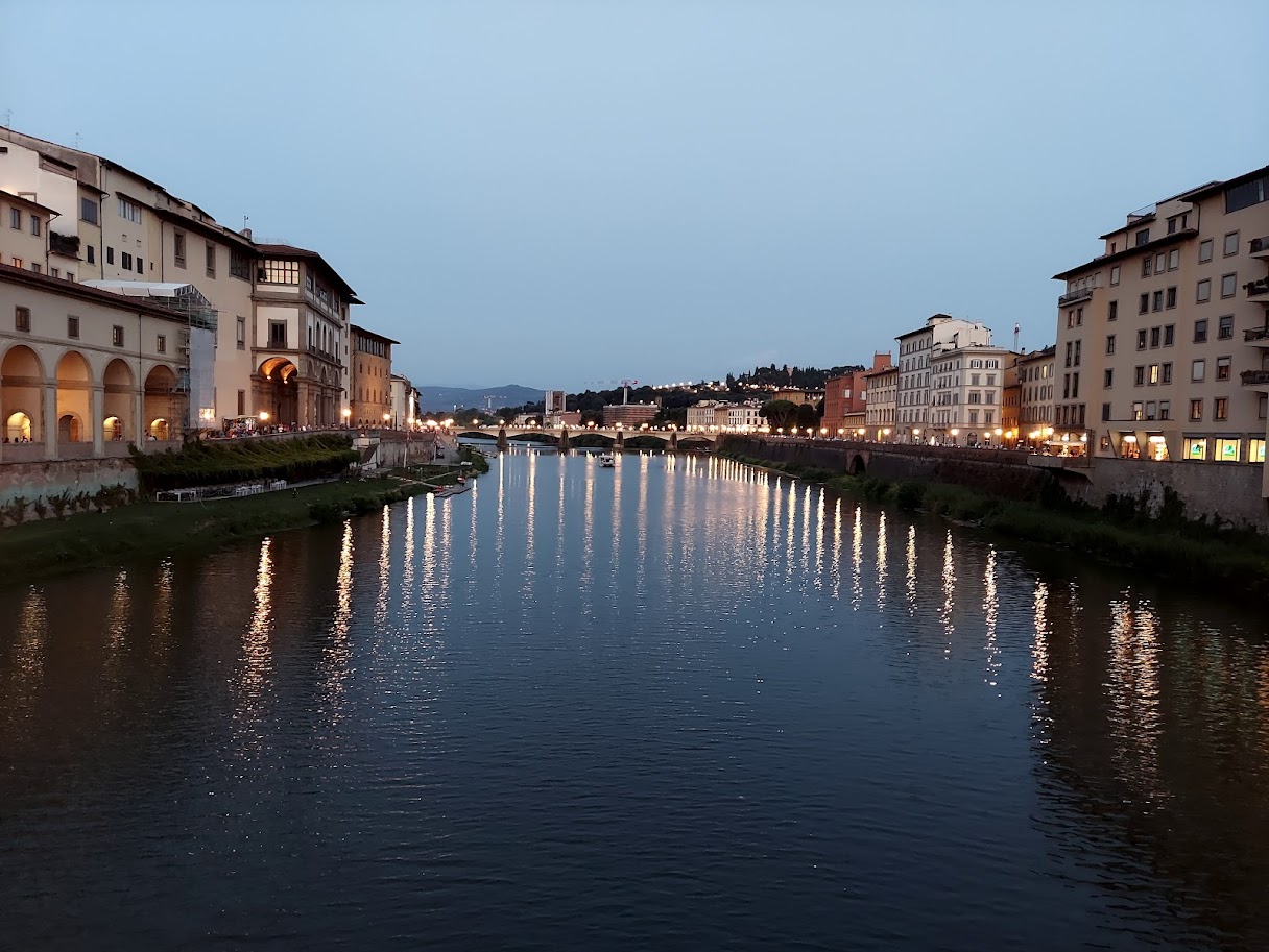 canal at dusk with golden lights on water