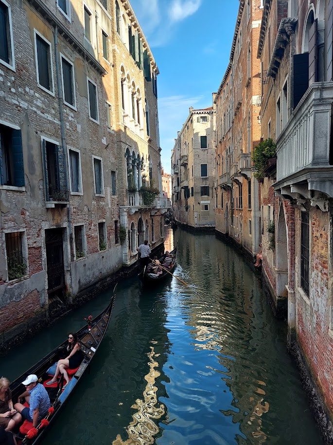 gondola on the river between two buildings