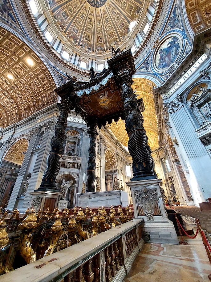 bronze sculpted canopy inside a basilica church