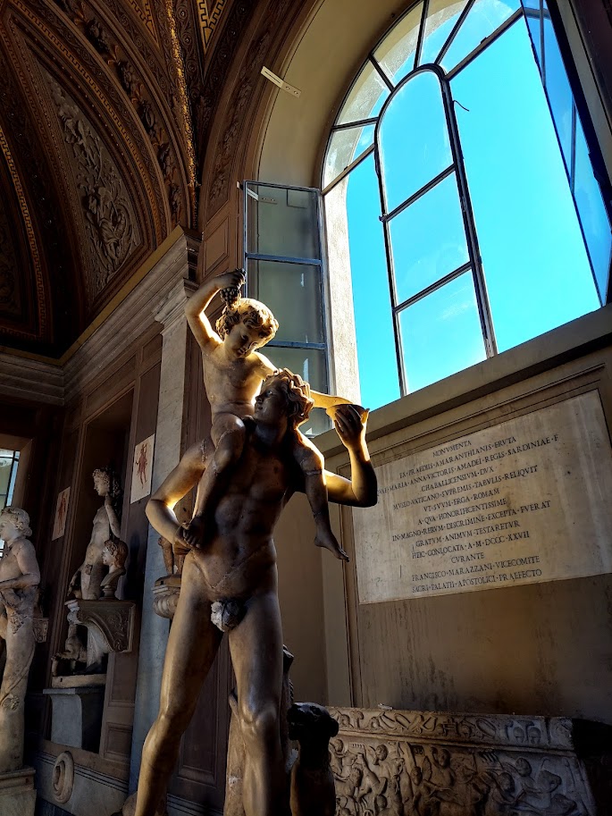 child on mans shoulder statue