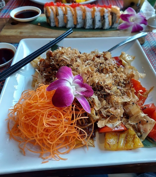 noodle dish with purple flower