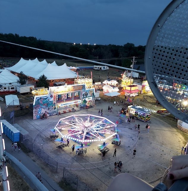 view of a carnival on top of a ferris wheel