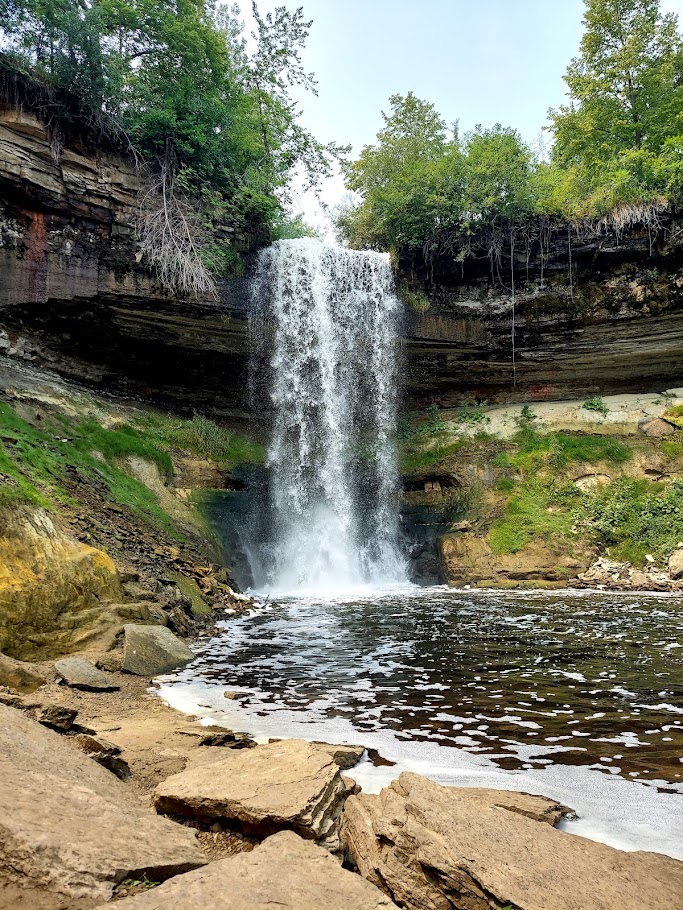 waterfall into river in the woods