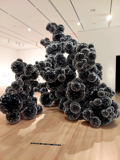 black sculpture resembling puffy bubbles