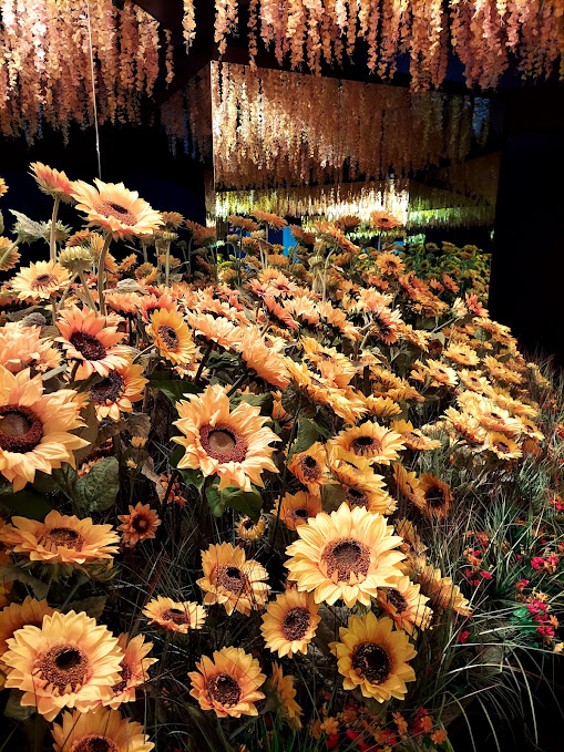 room of fake sunflowers