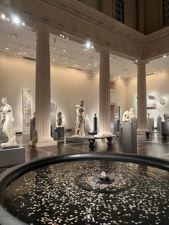 coin fountain in a statue exhibit