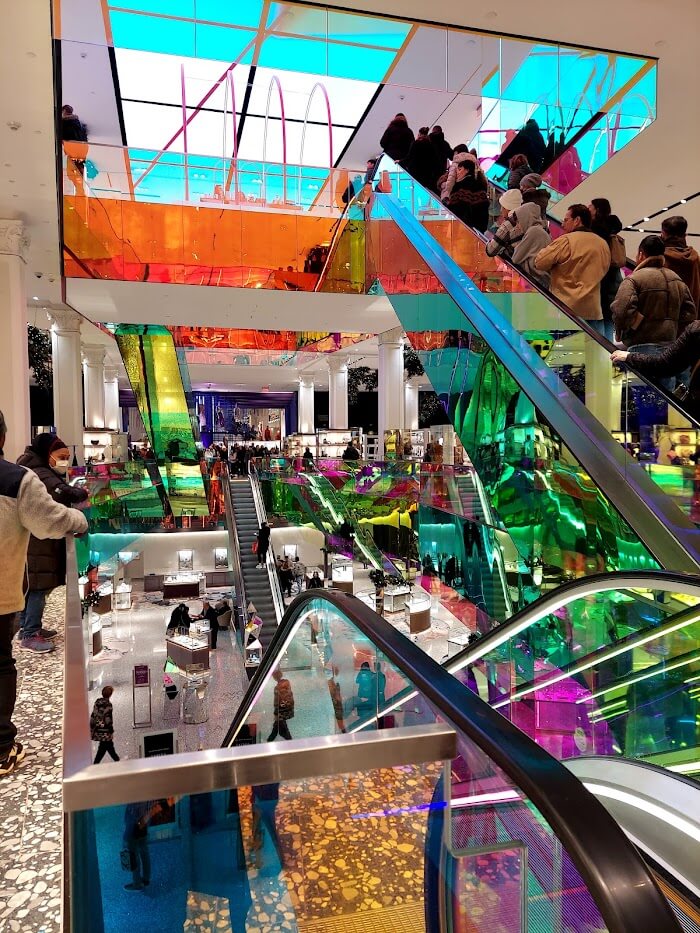 mall escalators with shiny rainbow glass