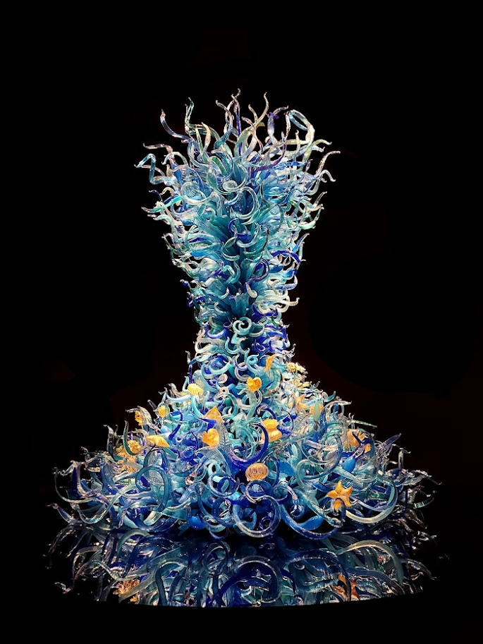 glass tower of swirling blue and sea life sculptures