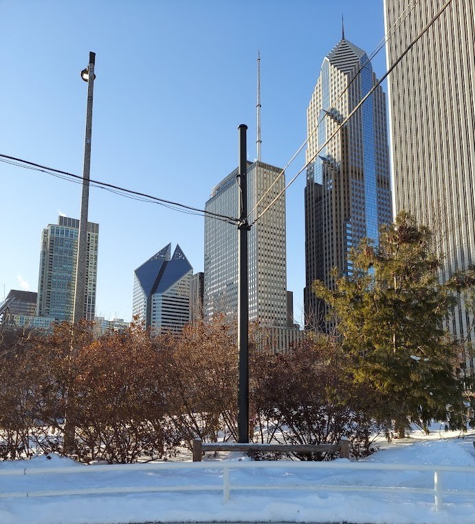 ice skating rink surrounded by skyscrapers