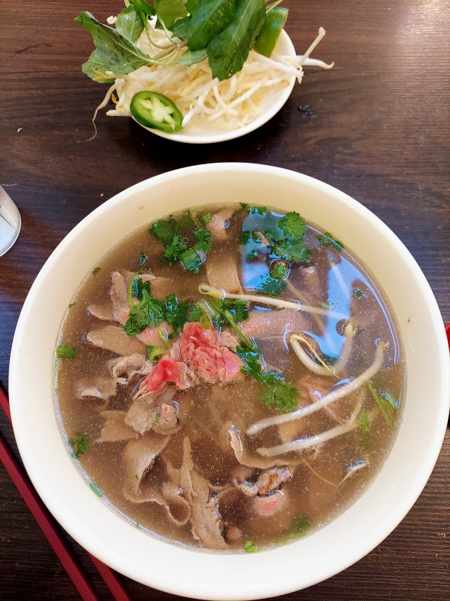 bowl of steak pho with bean sprouts