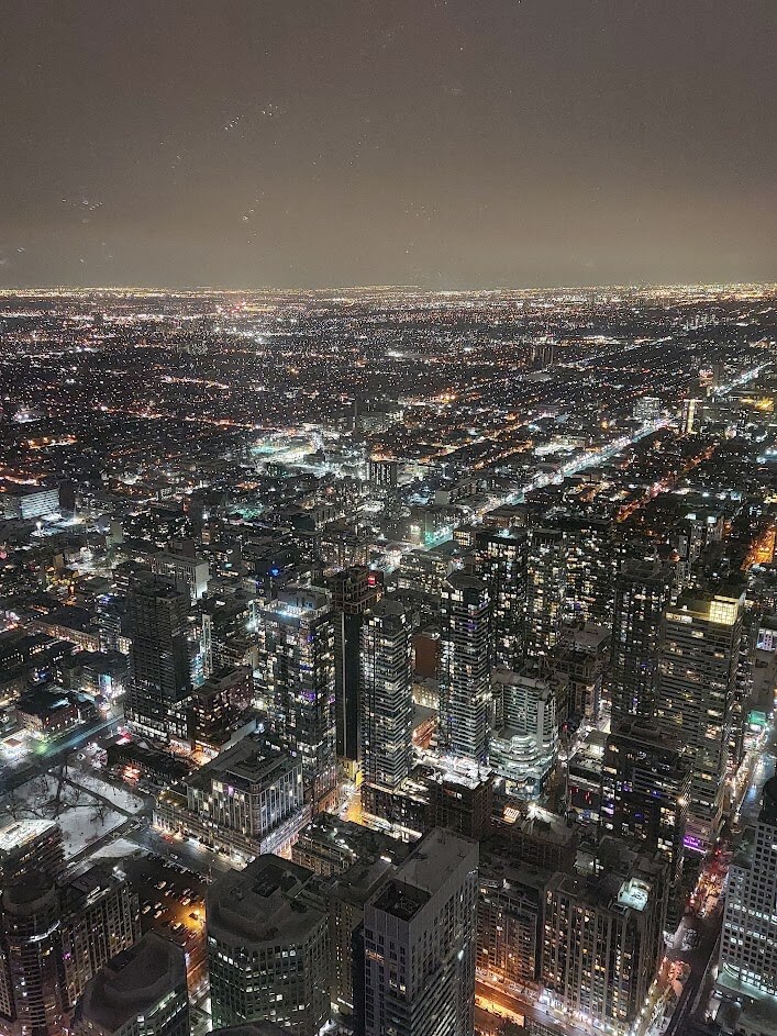 city lights at night from the top of the cn tower