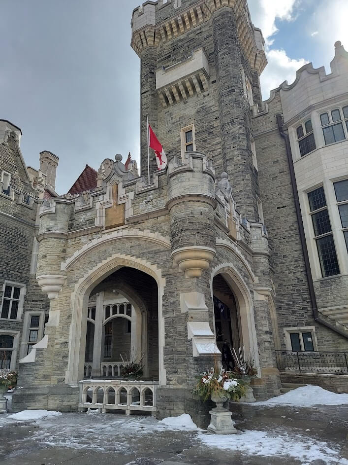 gothic castle like mansion with canadian flag